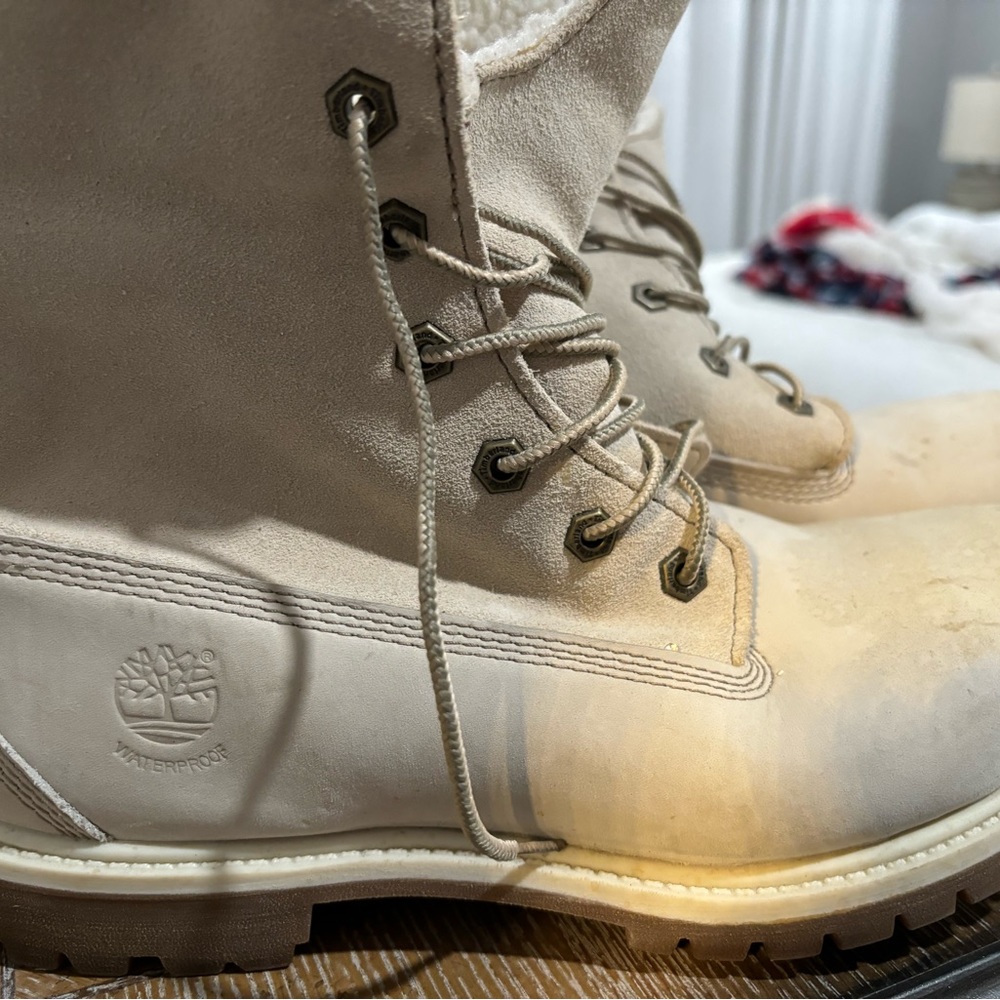 Timberland work boots  some kinda marks on the front.